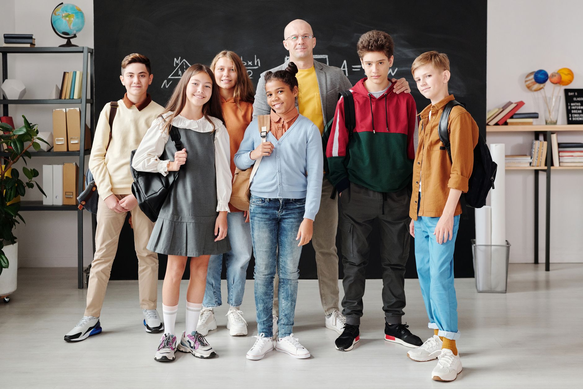 Group of diverse teenagers posing with their teacher in a modern classroom. — Roulette Probability Free Spins: A Comprehensiv
